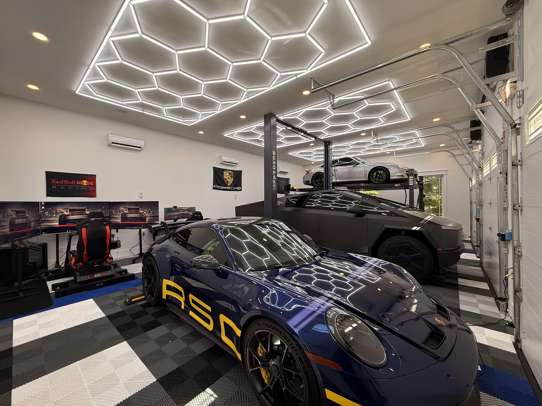 The Collector's Garage garage with hex lighting and cars
