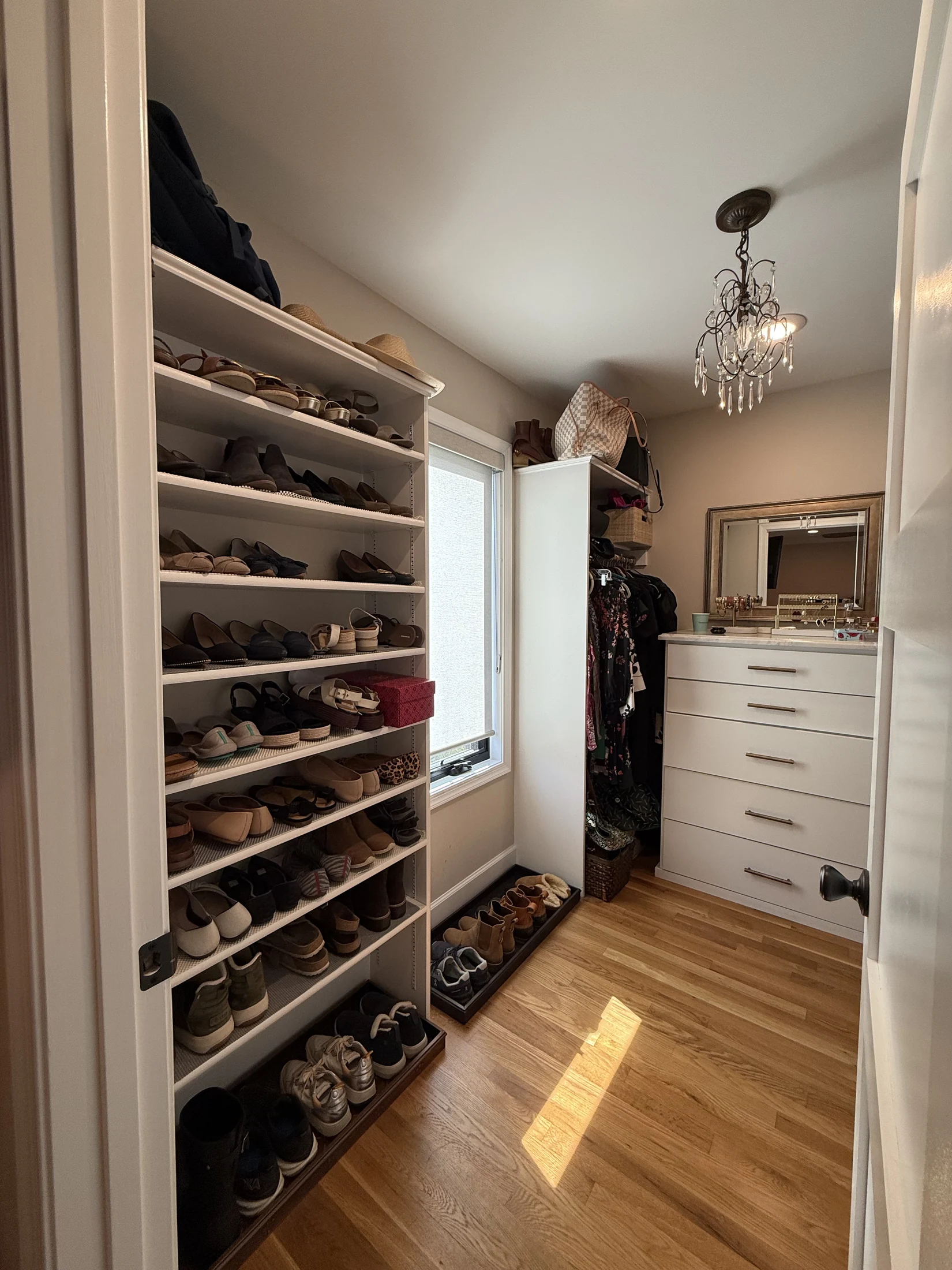 Walk-in closet with shelving and drawer storage
