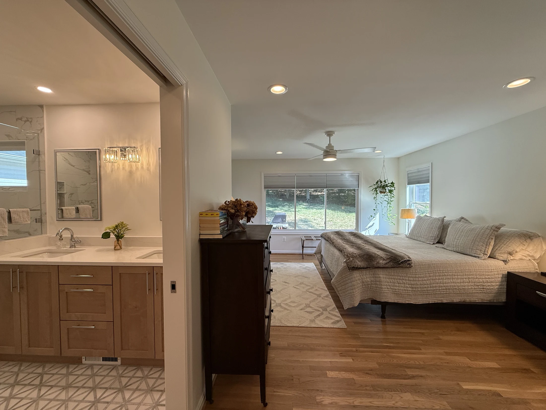Primary bedroom with a view into the expanded bathroom