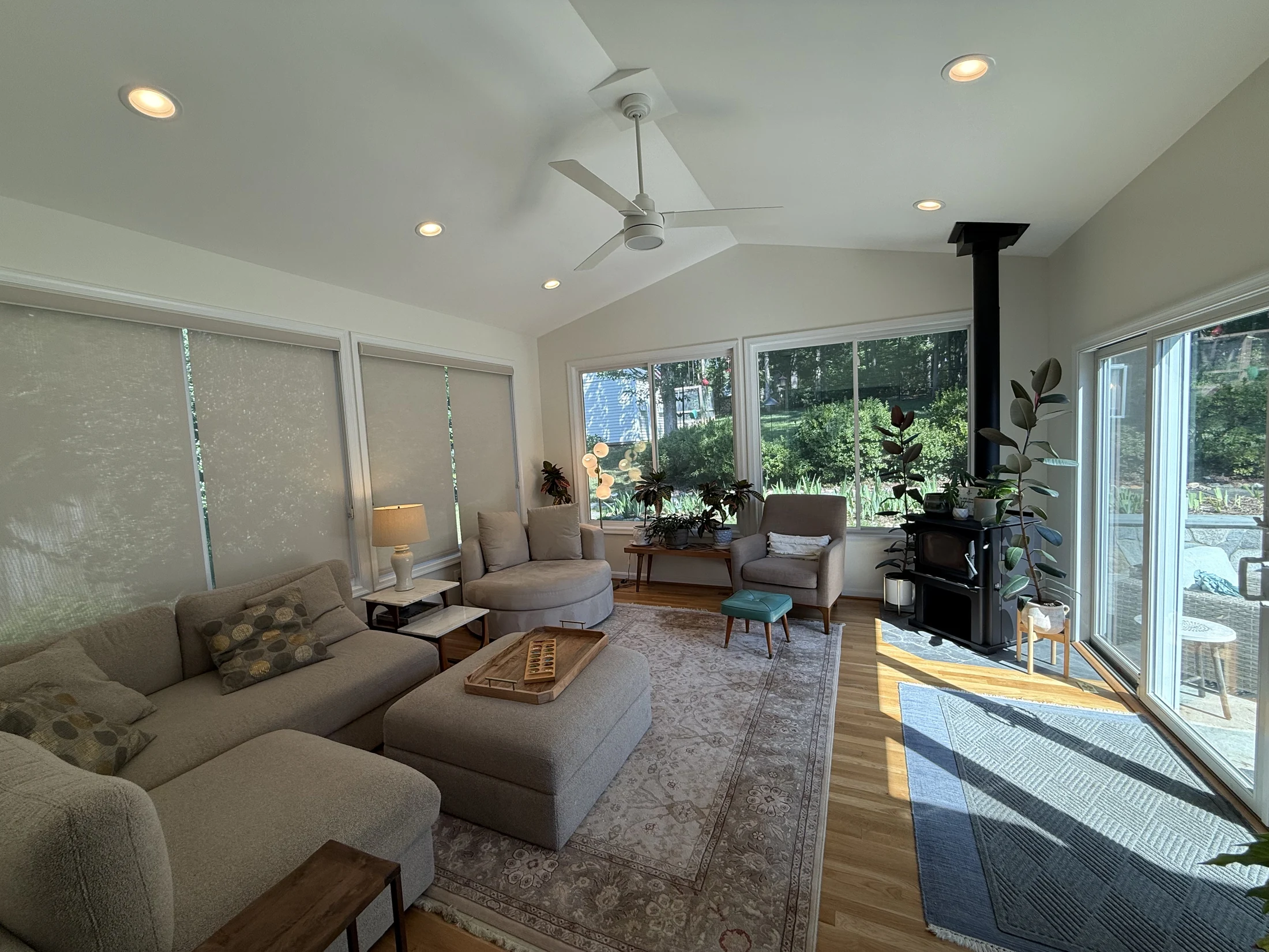 Sunlit seating area beneath the vaulted sunroom ceiling