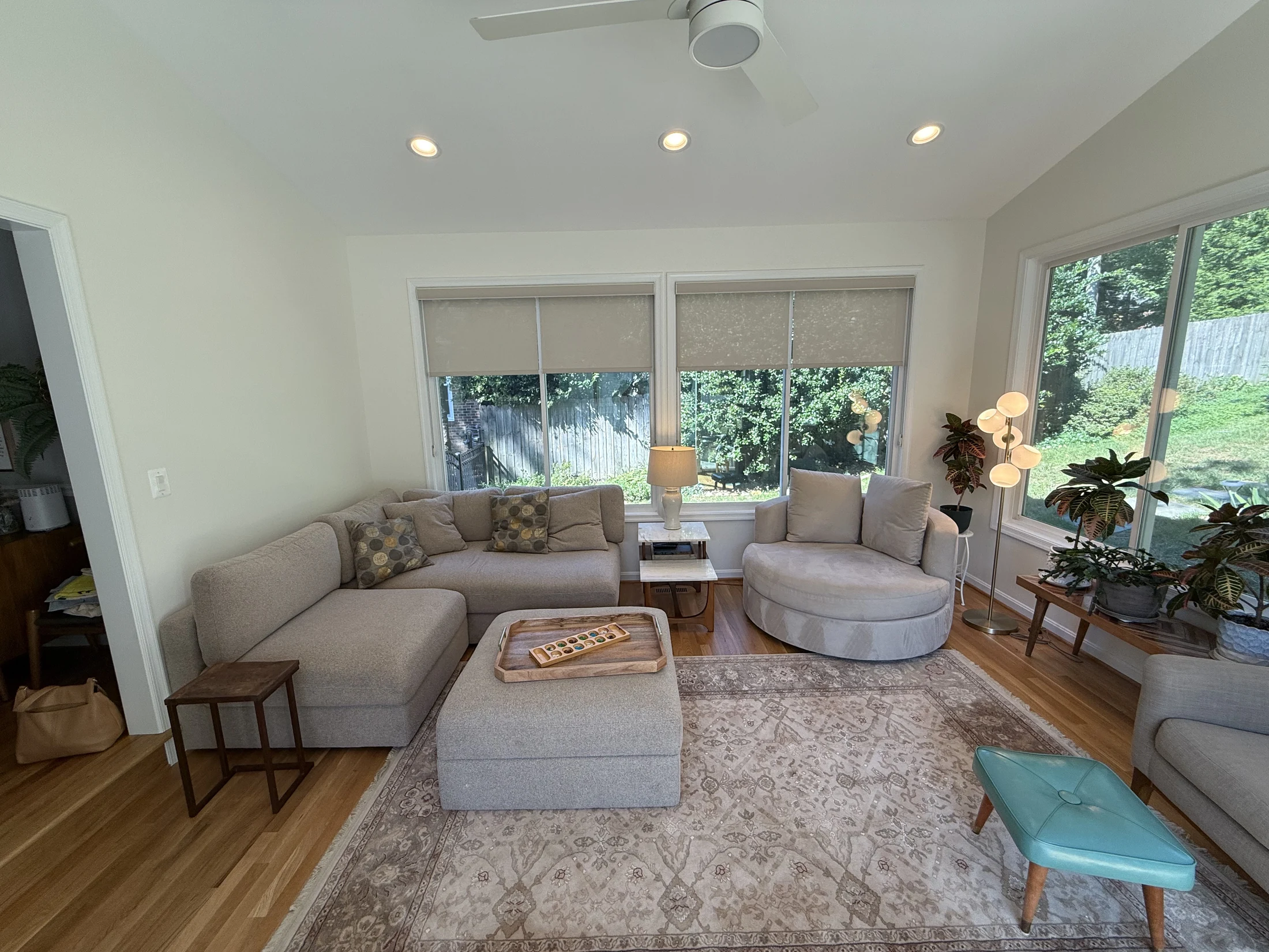 Sunroom lounge with a sectional and armchair