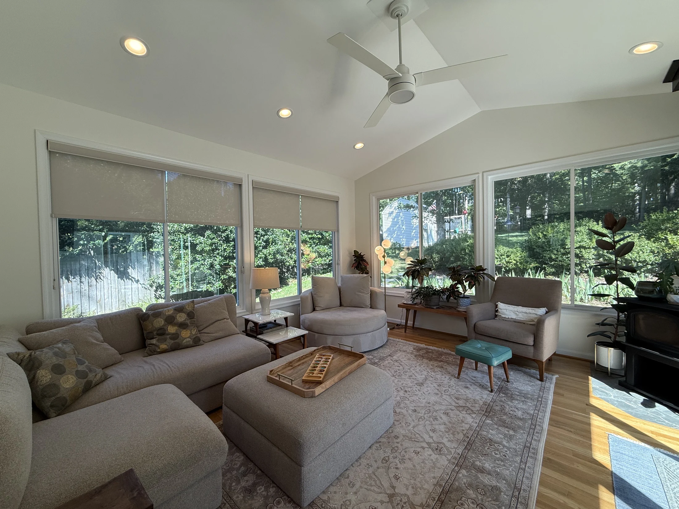 Sunroom seating and windows overlooking the garden