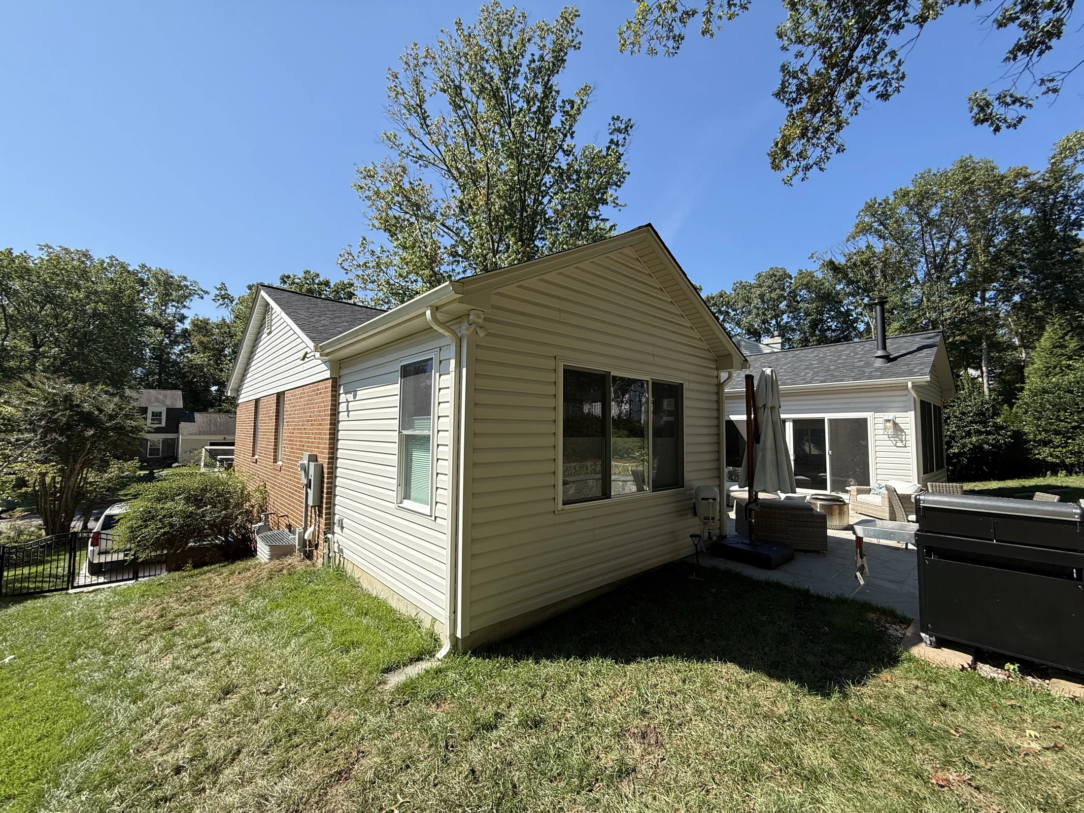 Rear primary bedroom suite addition beside the patio