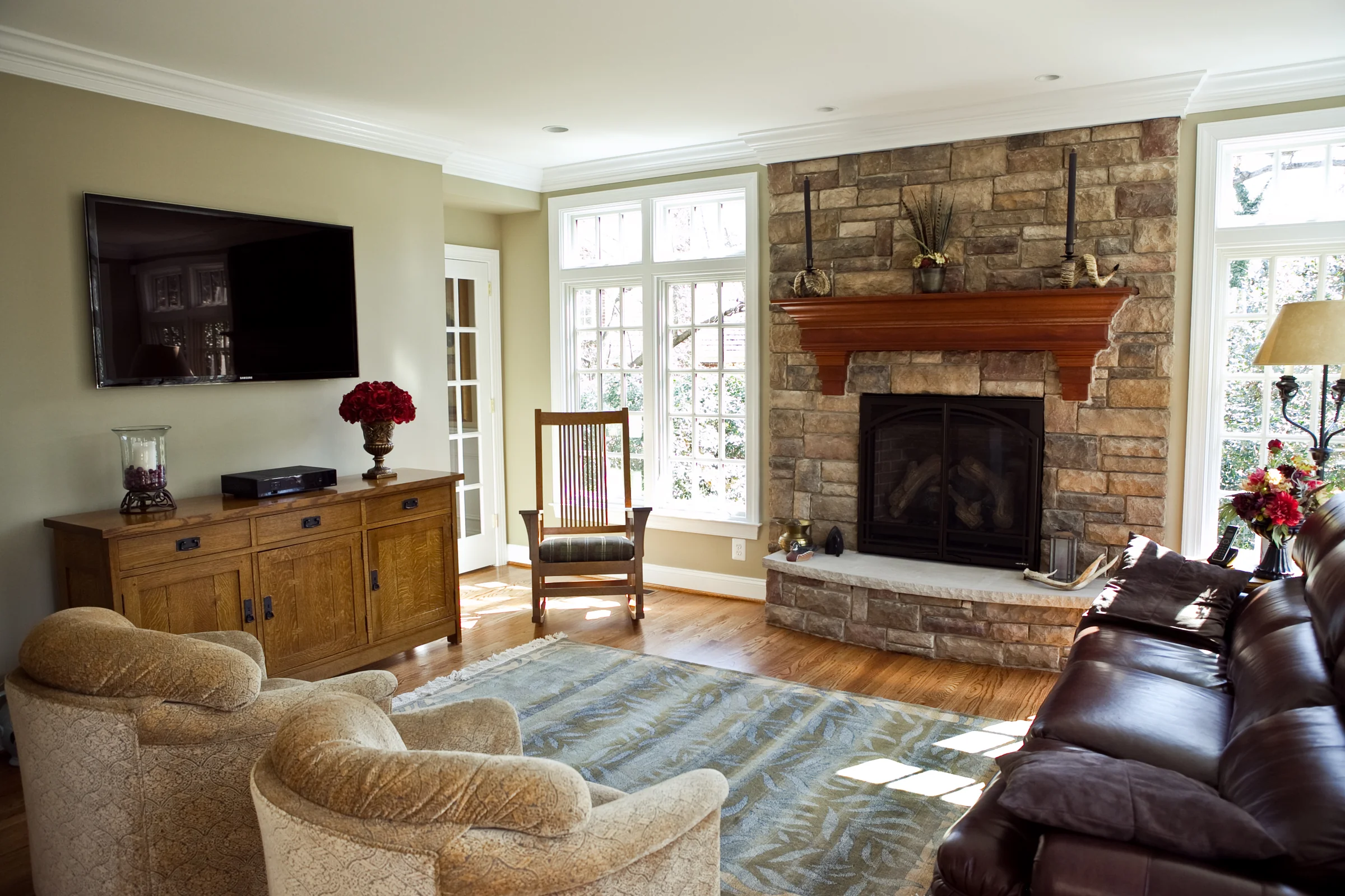 Seamless Two-Story Addition family room with stone fireplace
